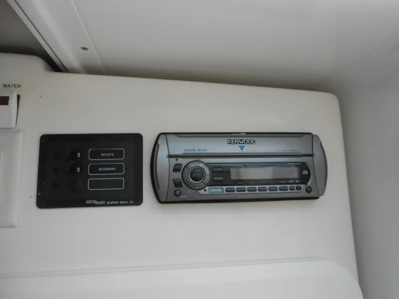 Slide: The Image of Kenwood stereo system and control panel in 2007 Sunsation 32 SS boat interior. - 13