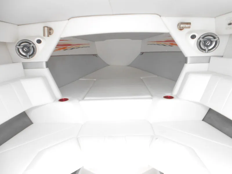 Slide: The Image of 2007 Sunsation 32 SS boat interior with white seating and speakers. - 14