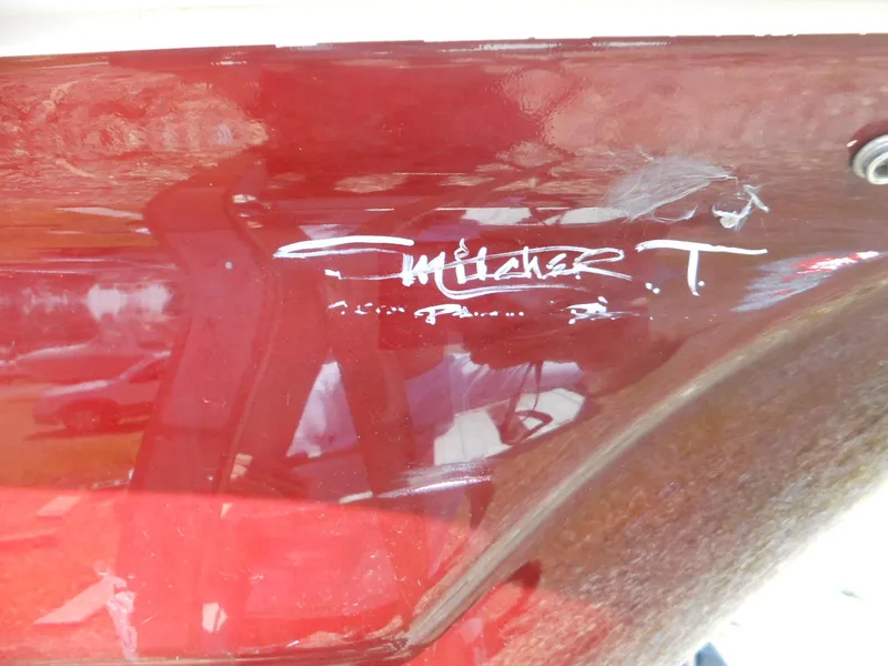 Slide: The Image of 2007 Sunsation 32 SS boat with signature on red hull. - 5