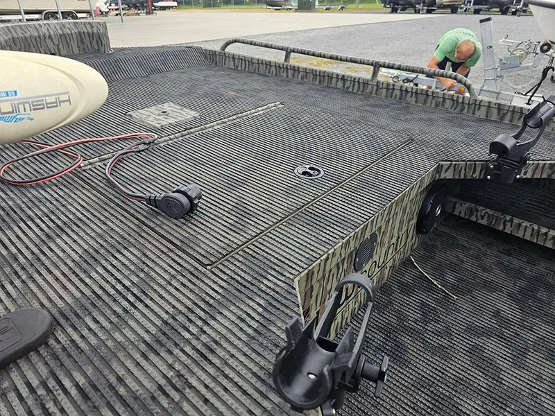 Slide: The Image of 2023 Low Country Swamp Fox 1854 boat deck with fishing rod holders and wiring. - 10