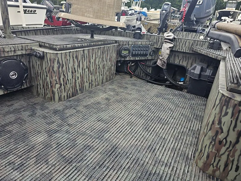 Slide: The Image of 2023 Low Country Swamp Fox 1854 boat interior with camouflage design and equipment. - 12