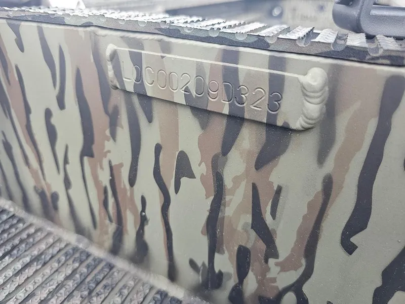 Slide: The Image of Camouflage-patterned Low Country Swamp Fox 1854 boat with serial number, 2023 model. - 13