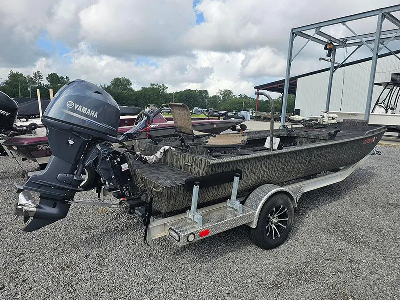 Slide: The Image of 2023 Low Country Swamp Fox 1854 boat with Yamaha motor on a trailer. - 3