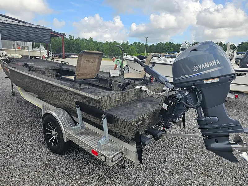 Slide: The Image of 2023 Low Country Swamp Fox 1854 boat with Yamaha motor on a trailer. - 6