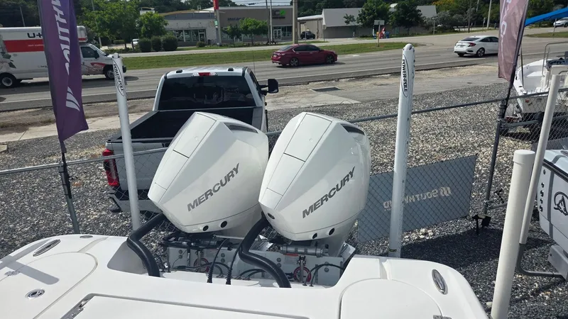 Slide: The Image of 2024 Blazer Bay 2700 Hybrid Bay with dual Mercury outboard engines. - 3