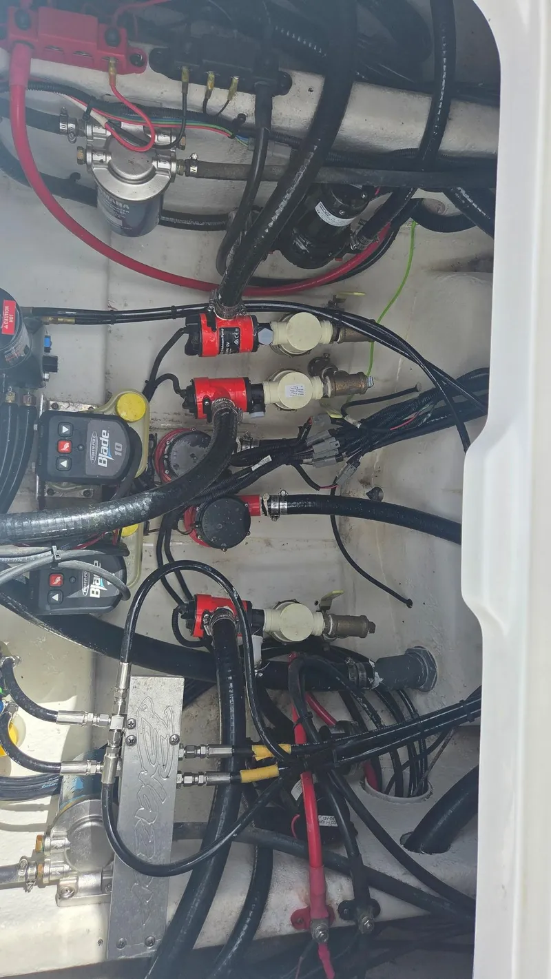 Slide: The Image of Engine compartment of 2024 Blazer Bay 2700 Hybrid Bay boat, showcasing wiring and components. - 8