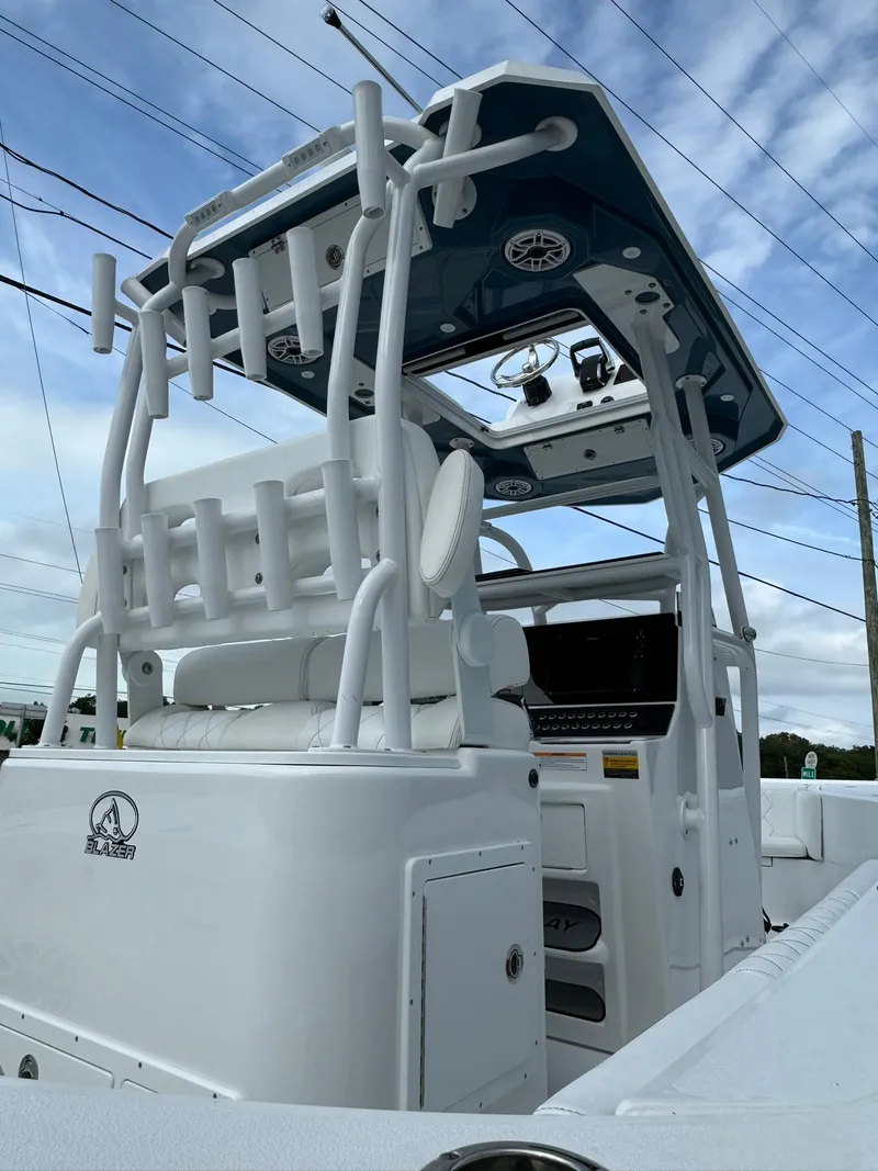 Slide: The Image of 2024 Blazer Bay 2700 Hybrid Bay boat, featuring sleek design and modern amenities. - 9