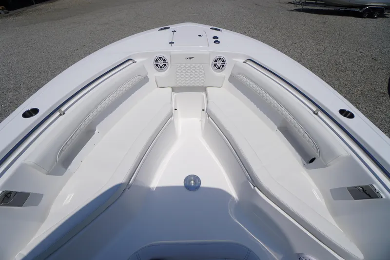 Slide: The Image of 2026 Tidewater 232 LXF boat interior with white seating and stainless steel accents. - 15