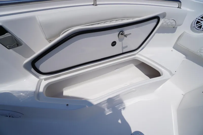 Slide: The Image of Storage compartment on a 2026 Tidewater 232 LXF boat, featuring a secure lock. - 19