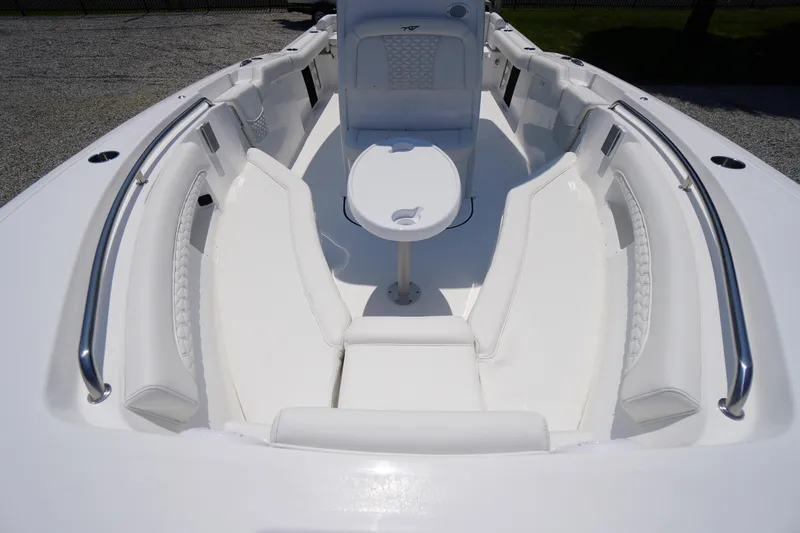 Slide: The Image of 2026 Tidewater 232 LXF boat interior with white seating and table. - 21