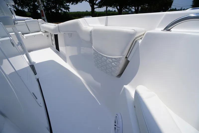 Slide: The Image of 2026 Tidewater 232 LXF boat interior with white seating and modern design. - 24