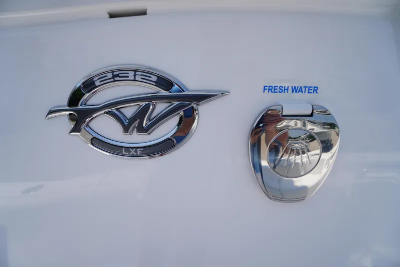 Slide: The Image of 2026 Tidewater 232 LXF boat emblem and fresh water access. - 26