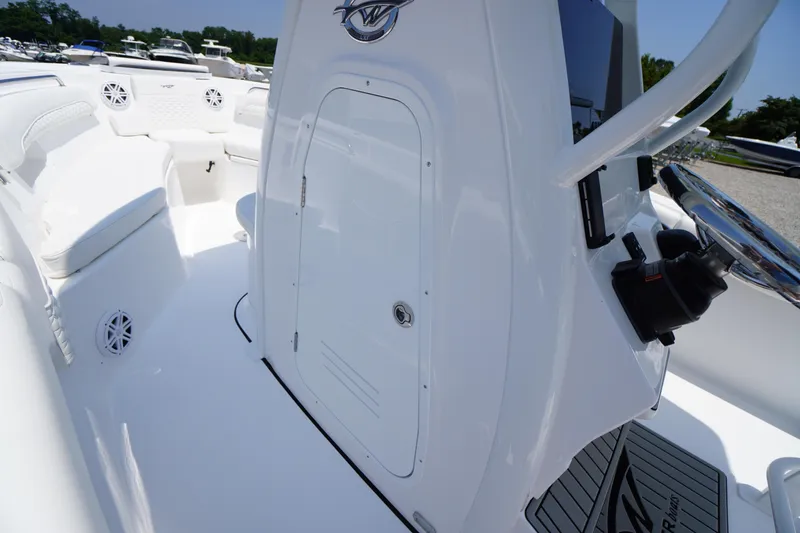 Slide: The Image of 2026 Tidewater 232 LXF boat interior with seating and control panel. - 28