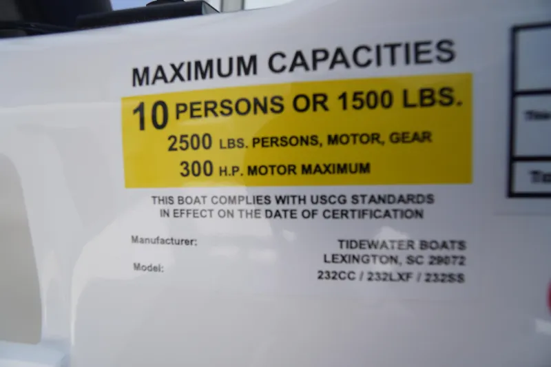 Slide: The Image of 2026 Tidewater 232 LXF boat capacity label, 10 persons or 1500 lbs, 300 HP max. - 31
