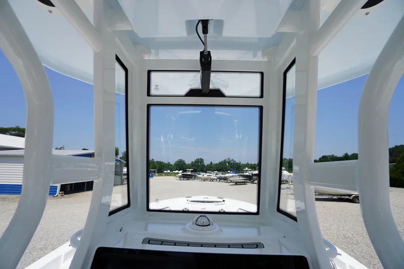 Slide: The Image of Interior view of 2026 Tidewater 232 LXF boat, showcasing windshield and dashboard. - 32