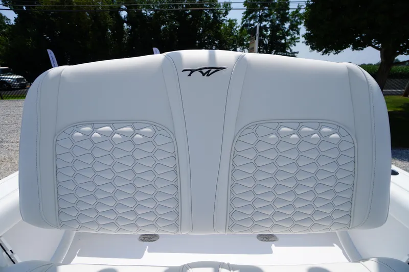 Slide: The Image of 2026 Tidewater 232 LXF boat seat with elegant white upholstery and hexagonal stitching. - 38