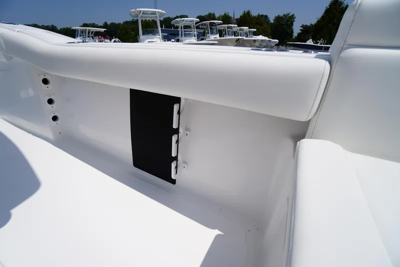 Slide: The Image of 2026 Tidewater 232 LXF boat interior, featuring sleek white seating and modern design elements. - 39