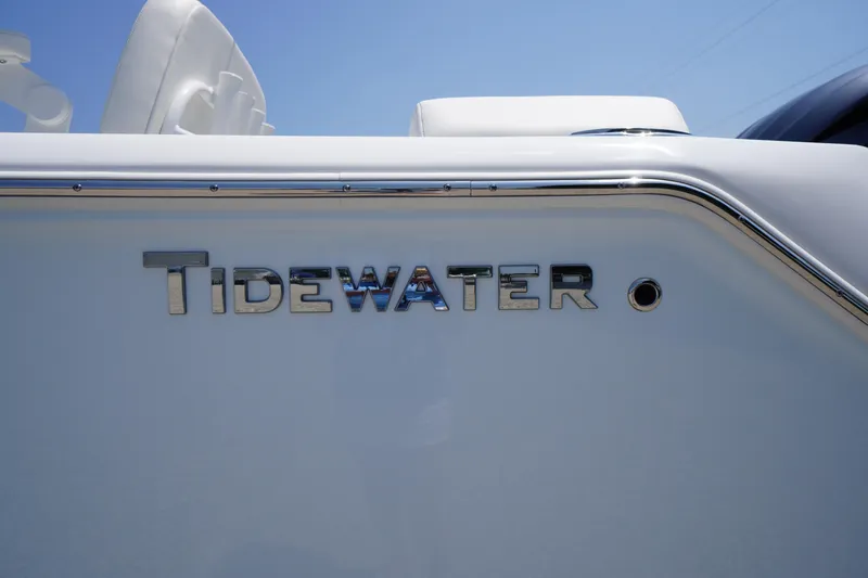 Slide: The Image of 2026 Tidewater 232 LXF boat logo on sleek white surface. - 4