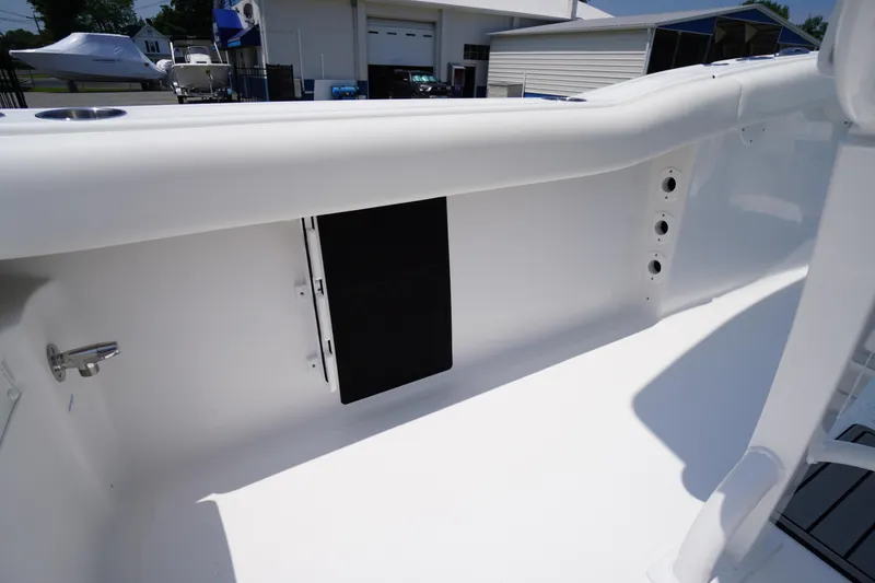 Slide: The Image of 2026 Tidewater 232 LXF boat interior detail, showcasing sleek white design and storage features. - 40