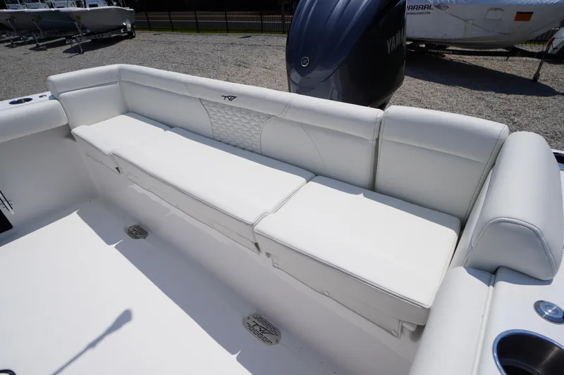Slide: The Image of 2026 Tidewater 232 LXF boat with white cushioned seating and Yamaha engine. - 42