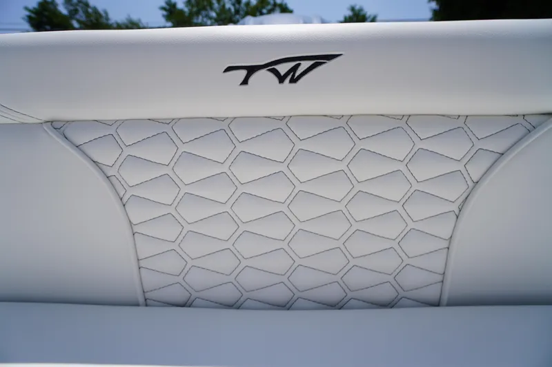 Slide: The Image of 2026 Tidewater 232 LXF boat seat with hexagonal stitching and logo. - 45