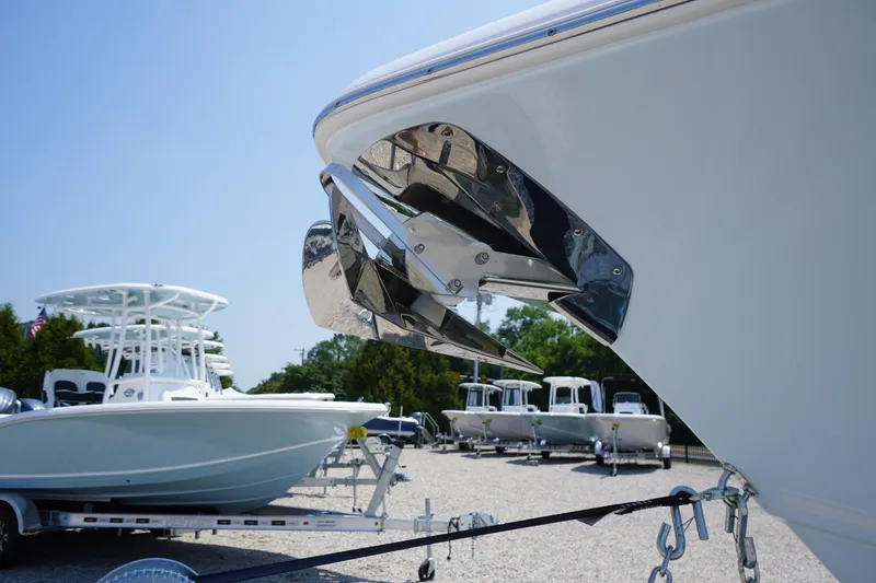 Slide: The Image of 2026 Tidewater 232 LXF boat with anchor, displayed in a sunny outdoor setting. - 5