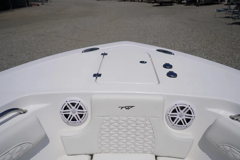 Slide: The Image of 2026 Tidewater 232 LXF boat interior with speakers and white seating. - 6