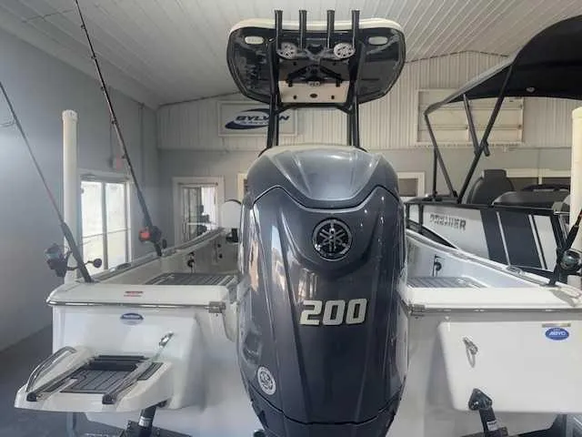 Slide: The Image of 2024 Tidewater 2210CB boat with powerful 200 HP engine in showroom. - 3