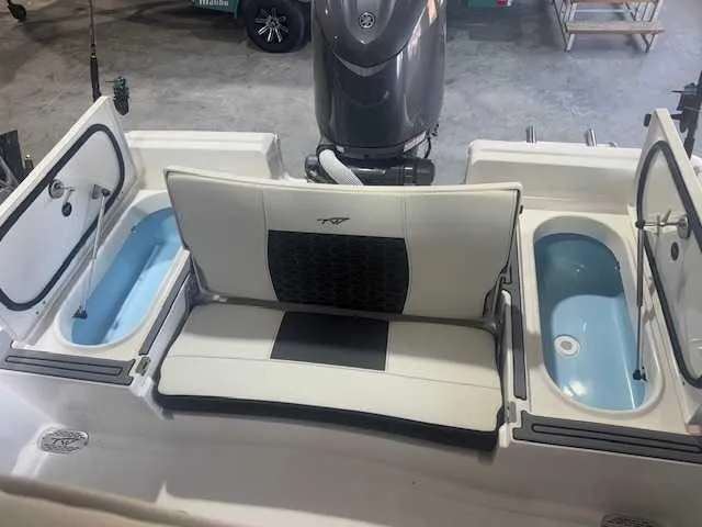 Slide: The Image of 2024 Tidewater 2210CB boat interior with seating and storage compartments. - 7