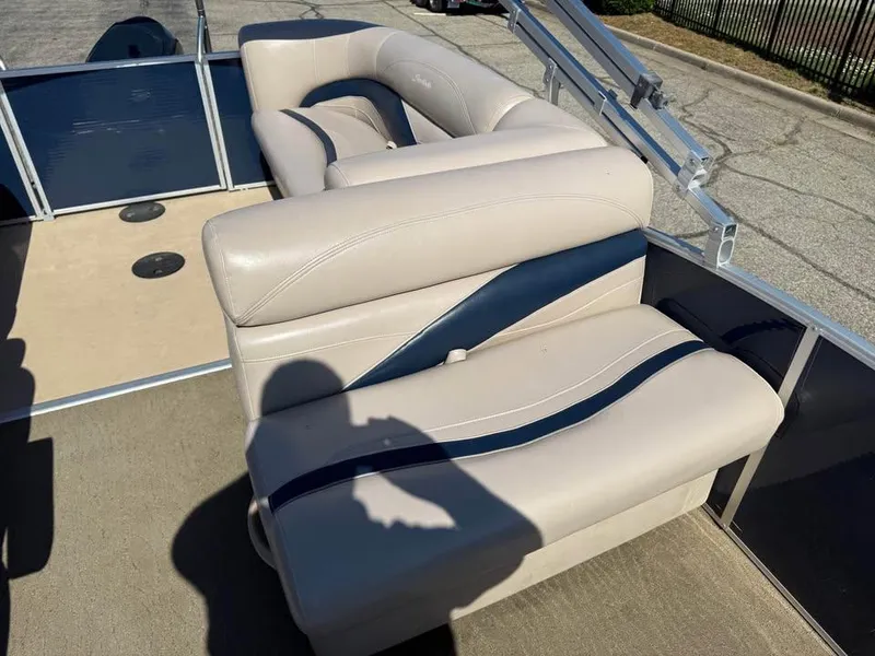Slide: The Image of 2014 Godfrey 220 SL boat interior with beige and blue seating. - 11