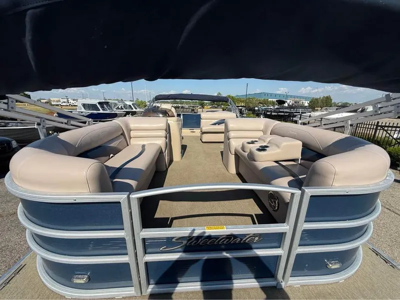 Slide: The Image of 2014 Godfrey 220 SL pontoon boat with spacious seating and cup holders. - 5
