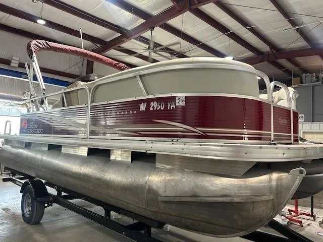 Slide: The Image of 2012 Sun Tracker Party Barge 20 DLX pontoon boat in a warehouse setting. - 7