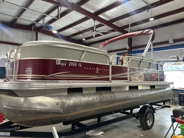 Slide: The Image of 2012 Sun Tracker Party Barge 20 DLX pontoon boat in a warehouse setting. - 8