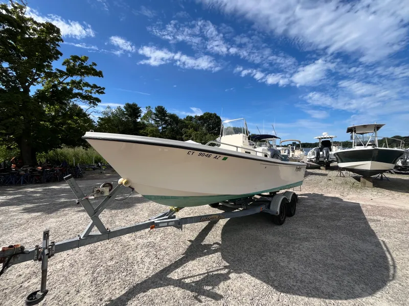 Slide: The Image of 2005 Parker 2100 Special Edition boat on trailer under clear blue sky. - 1