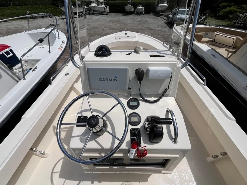 Slide: The Image of 2005 Parker 2100 Special Edition boat console with Garmin navigation system and steering wheel. - 18