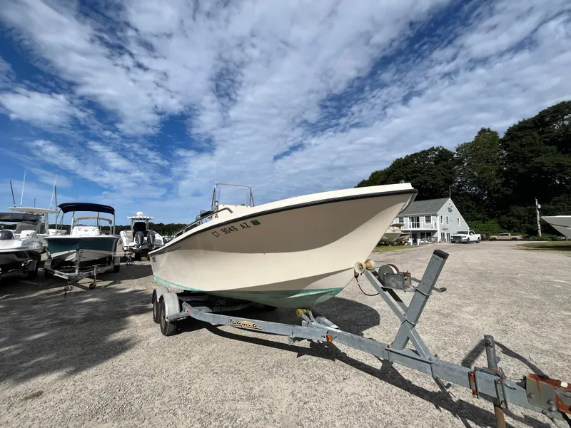 Slide: The Image of 2005 Parker 2100 Special Edition boat on trailer under blue sky. - 2