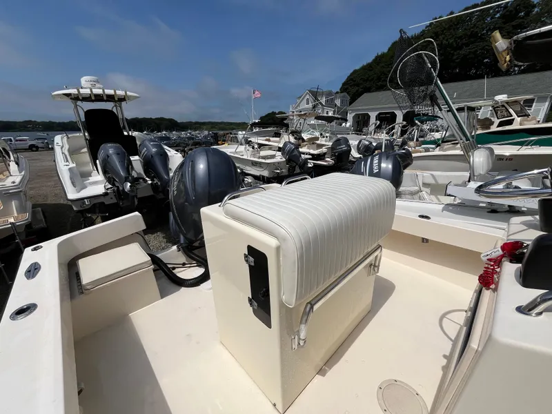 Slide: The Image of 2005 Parker 2100 Special Edition boat with Yamaha engines, docked in a marina. - 20