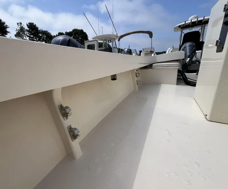 Slide: The Image of 2005 Parker 2100 Special Edition boat deck with fishing rods and equipment. - 22