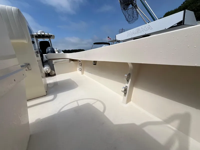 Slide: The Image of 2005 Parker 2100 Special Edition boat deck with Magma grill, under clear blue sky. - 23