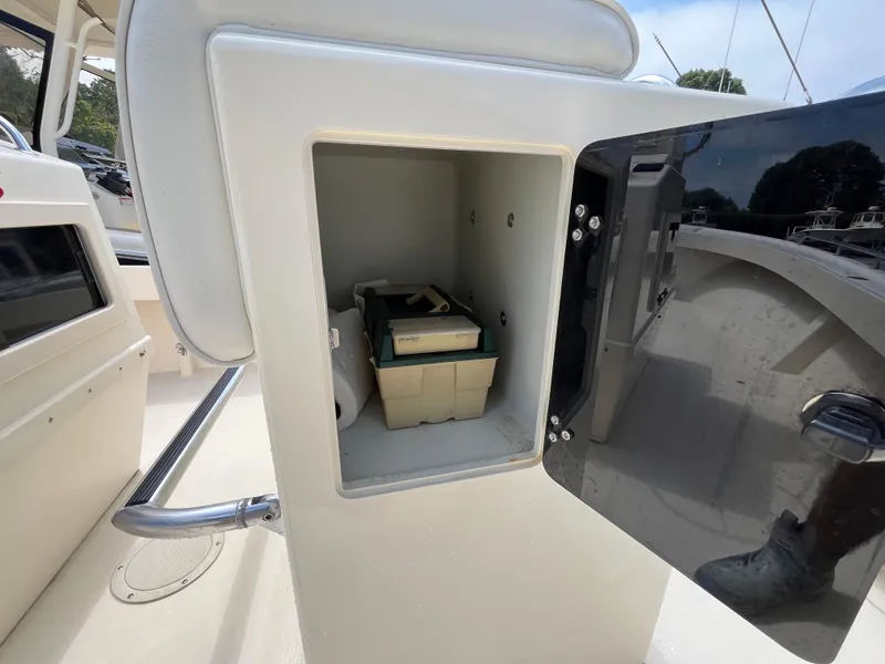 Slide: The Image of Open storage compartment on a 2005 Parker 2100 Special Edition boat. - 24
