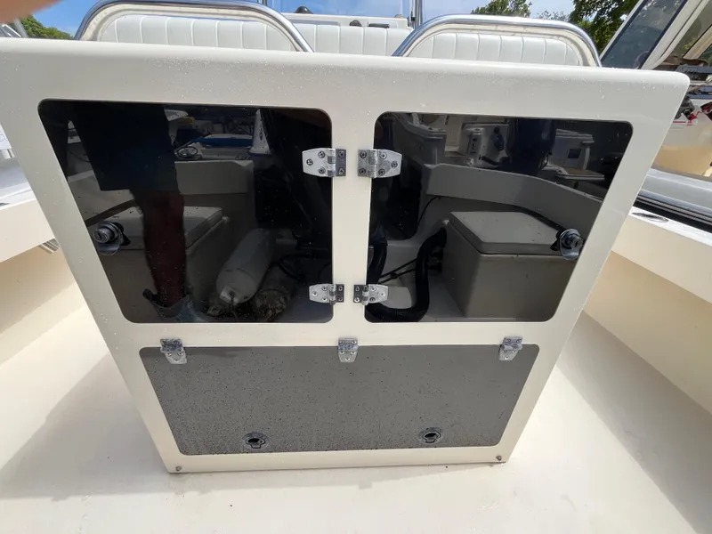 Slide: The Image of 2005 Parker 2100 Special Edition boat interior with storage compartments and seating. - 26