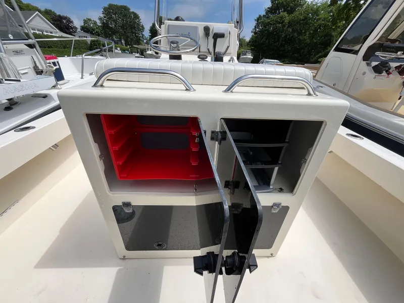 Slide: The Image of Open storage compartment on a 2005 Parker 2100 Special Edition boat. - 27