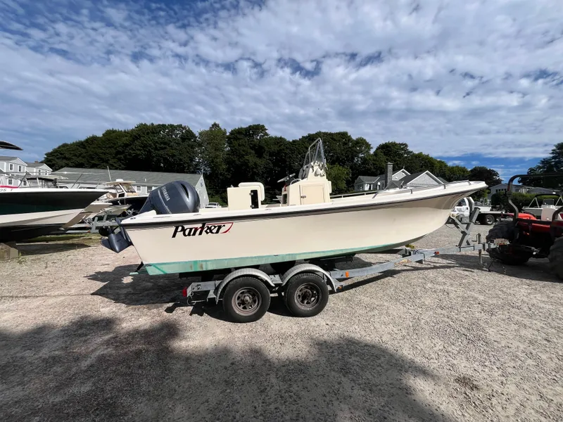 Slide: The Image of 2005 Parker 2100 Special Edition boat on trailer under cloudy sky. - 3