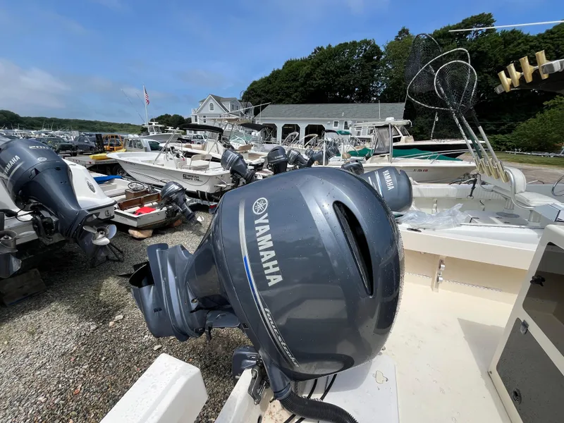 Slide: The Image of Boats with Yamaha outboard motors at a marina, featuring a 2005 Parker 2100 Special Edition. - 31