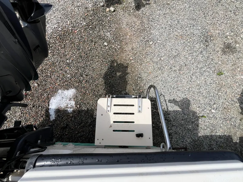 Slide: The Image of Rear view of a 2005 Parker 2100 Special Edition boat on gravel. - 34