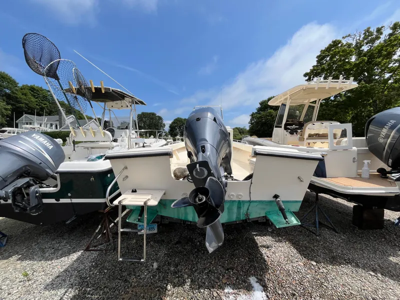 Slide: The Image of 2005 Parker 2100 Special Edition boat with Yamaha outboard motor, docked on gravel. - 35