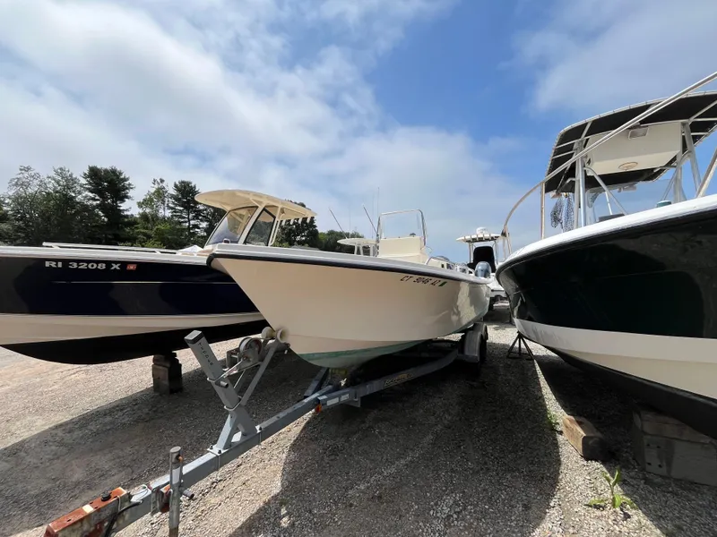 Slide: The Image of 2005 Parker 2100 Special Edition boat on trailer, flanked by two other boats. - 36