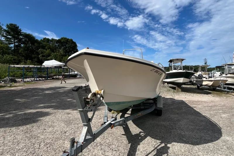 Slide: The Image of 2005 Parker 2100 Special Edition boat on trailer under clear blue sky. - 43