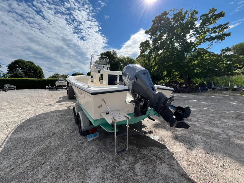Slide: The Image of 2005 Parker 2100 Special Edition boat on trailer under sunny sky. - 5