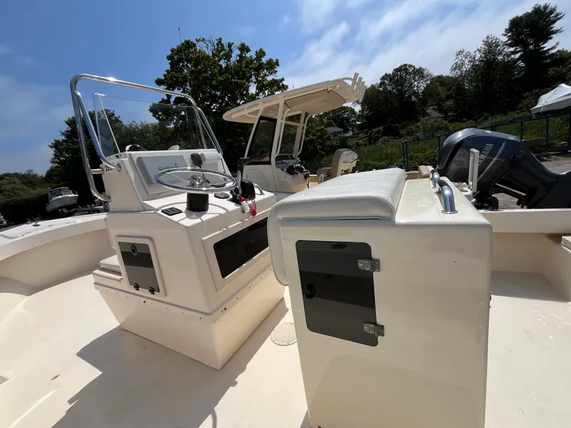 Slide: The Image of 2005 Parker 2100 Special Edition boat interior with steering console and seating. - 8